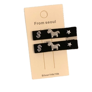 Vintage black velvet hair clips featuring crystal horse, star, and dollar sign charms