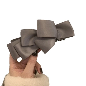 Elegant grey satin banana hair clip featuring multi-layered bow design for women