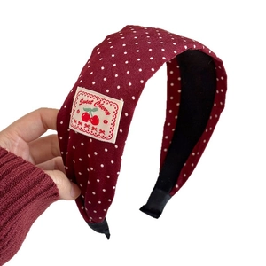 Padded red polka dot headband with Sweet Cherry embroidery and non-slip inner lining