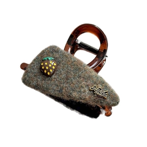 Vintage amber strawberry hair claw clip with grey felt texture and handmade metal tag