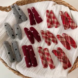 Red plaid and polka dot knitted hair clips set for women in cozy autumn winter style