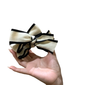 French style striped knit bow hair clip in black and white with premium banana clip design