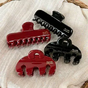 Elegant red and black rectangular hair claws in high-gloss resin for French style hairstyles