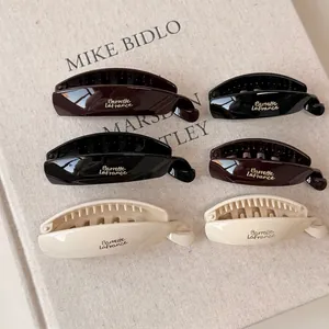 6-piece set of minimalist French resin hair clips in black, brown, and cream white