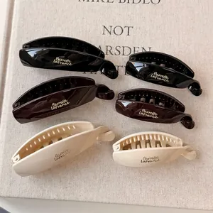 Minimalist resin banana hair clip set in black and white colors for elegant high ponytail