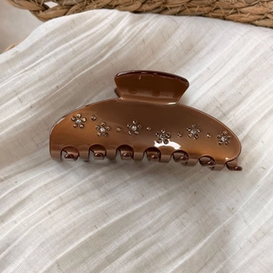 Brown acetic acid hair claw clip with bear and flower rhinestones in amber finish