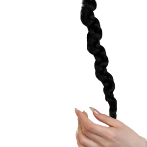 Polished black synthetic braided hair extensions for elegant styling on white background