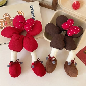 Christmas themed polka dot bow hair scrunchies with cute cartoon leg designs