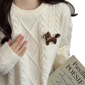 Cute brown plush horse brooch with red plaid saddle on a cream knit sweater decoration