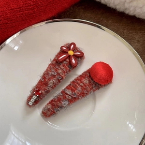 Elegant red knit floral hair clips set with pearls and plush balls for women