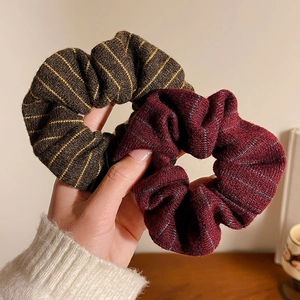 Set of two vintage striped knitted scrunchies in brown and burgundy for autumn hair styling