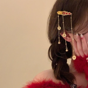 Traditional Chinese gold hairpin with red beads, tassels and coin pendants on hair