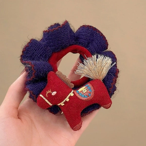 Chunky purple knit scrunchie with red plush horse and gold tassel for hair styling