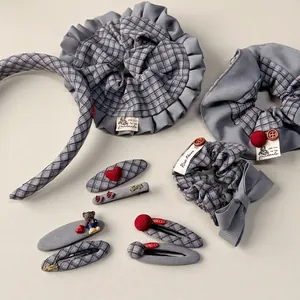 Blue-grey plaid fabric scrunchie set with bow detail and vintage hair clips