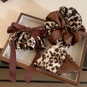 Brown leopard print satin scrunchie set and bow hair tie for elegant styling