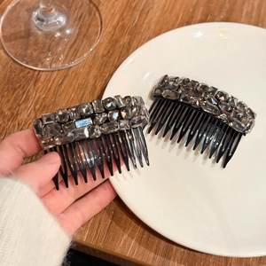 Elegant rhinestone hair comb set with sparkling crystals on black resin base for women