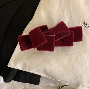 Elegant wine red velvet bow banana clip for a sophisticated high ponytail hairstyle
