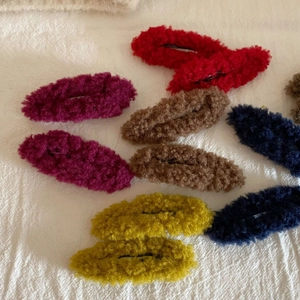Colorful oval teddy fleece hair clips for women in red, purple, and navy blue