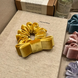 Premium velvet bow hair scrunchies in gold and morandi tones for elegant hairstyling
