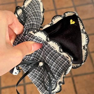 Elegant plaid bow hair claw with pearl accent in high-end Korean boutique style