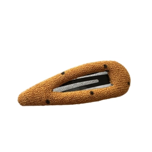 Brown knit hair clip with black polka dots, minimalist retro style for women hair styling