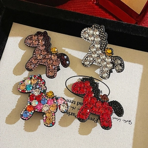Elegant horse-shaped hair clips with sparkling rhinestones in red, brown, and silver colors