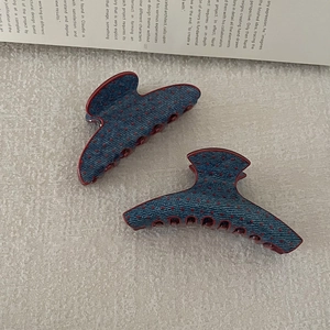 Retro polka dot hair claw clips in denim blue and red finish for elegant styling