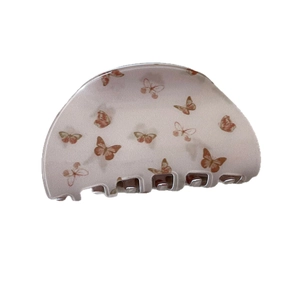 Cute peach hair claw clip with butterfly pattern for women's daily hairstyling