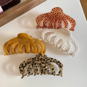 Set of four French retro acetate hair claws in leopard, marble, and solid patterns