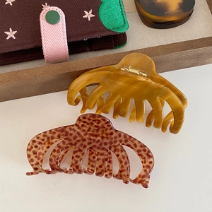 French vintage acetate hair claws in amber marble and tortoise patterns for women