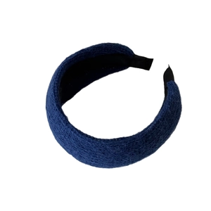 Thick navy blue knitted headband with textured fabric and soft black lining for women