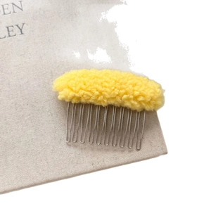 Bright yellow lamb wool hair comb accessory with silver metal teeth for elegant styling