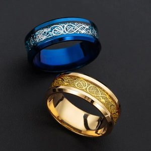 Detailed close-up of blue and gold dragon pattern celtic inlay titanium steel rings