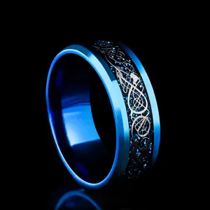 Detail of blue and black dragon inlay ring with polished inner band and beveled edges