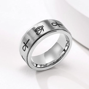 Detail of brushed titanium steel ring with Ankh and Eye of Horus engraved symbols