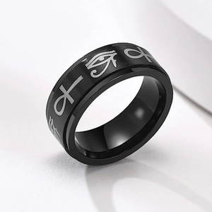 Detail of Eye of Horus and Ankh symbols engraved on a black stainless steel spinner ring