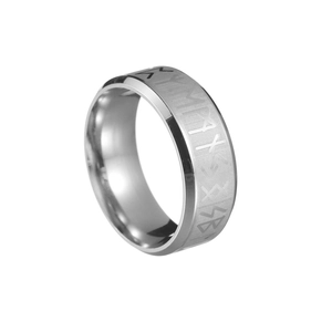 Macro shot of silver Viking ring showing intricate Norse runes and brushed metal texture