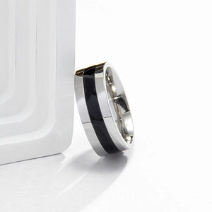 Polished silver stainless steel ring featuring a sleek black enamel center band inlay