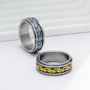 Titanium steel spinner ring with blue carbon fiber and golden dragon motif pattern