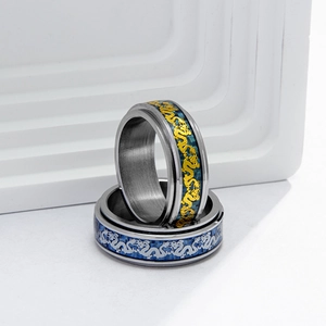 Titanium steel spinner ring with blue carbon fiber and golden dragon inlay pattern