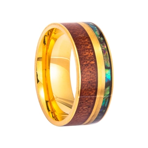 Macro detail of men's titanium ring with wood inlay and abalone shell colorful mosaic