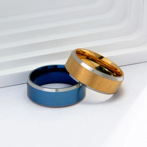 Modern men's titanium steel rings in blue and gold with silver beveled edges