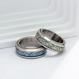Rotating stainless steel rings with blue carbon fiber and Celtic dragon pattern for men