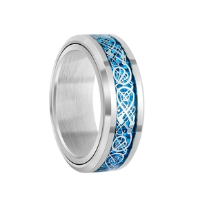 Detailed close-up of blue carbon fiber inlay with silver Celtic dragon pattern on steel ring
