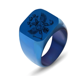 Detail shot of a matte blue titanium steel signet ring featuring a black eagle crest design