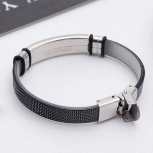Detail of adjustable stainless steel mesh bracelet with folding clasp and material engraving