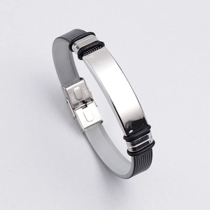 Detail of adjustable stainless steel mesh bracelet with silver plate and black silicone rings