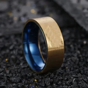 Brushed gold stainless steel men's ring with polished blue inner band on black stone