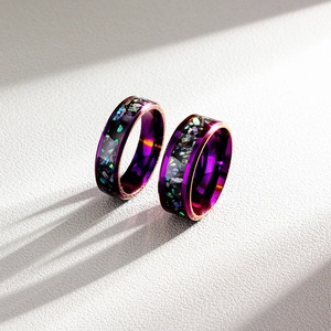 Detail of purple plated inner titanium steel rings with iridescent galaxy inlay