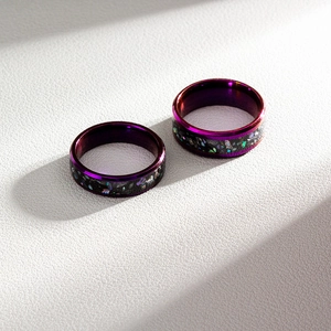 Titanium steel couple rings set with purple galaxy opal inlay and polished metal edges